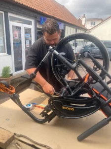 an enginner repairing an Active wheelchair