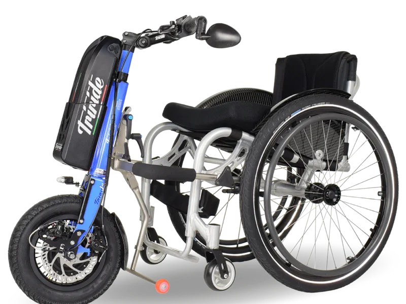 A side view of a white wheelchair wit a blue tri ride power attachment