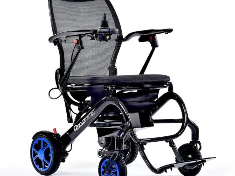 Side view of a q50 r lightweight powerchair with blue wheel hubs