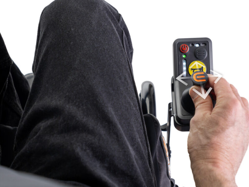 close up of an M90 wheel joystick with someones hand operating it